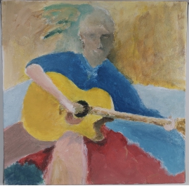 Seated boy with guitar